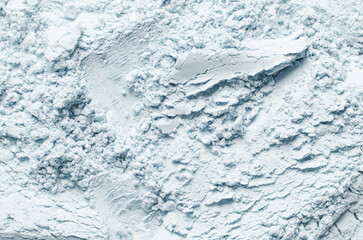 The texture of dry cosmetic clay for a skin mask.