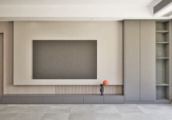 Interior of living room with a large TV shelf partition and many decorative open slots
