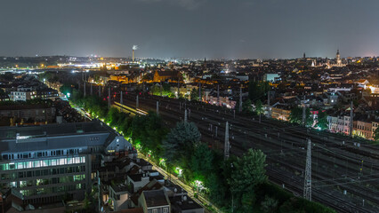 Fototapeta premium Aerial night timelapse of Brussels North station railway tracks with trains arriving and departing. Belgium