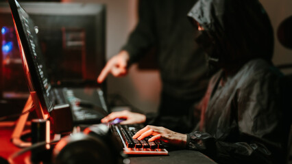 Hooded Hacker coding destroy online data system with virus ransomware in server..