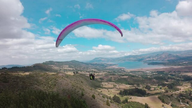 Paragliding hobby flying above the clouds enjoying leisure time couple gift experience extraordinary