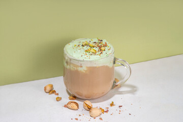 Vegan pistachio milk coffee latte. Iced and hot coffee drinks with plant based whipped pistachio...