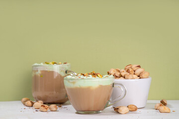 Vegan pistachio milk coffee latte. Iced and hot coffee drinks with plant based whipped pistachio...