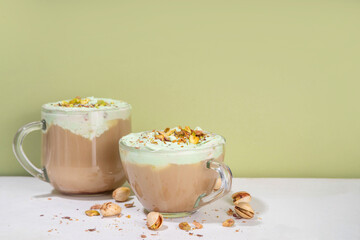 Vegan pistachio milk coffee latte. Iced and hot coffee drinks with plant based whipped pistachio...