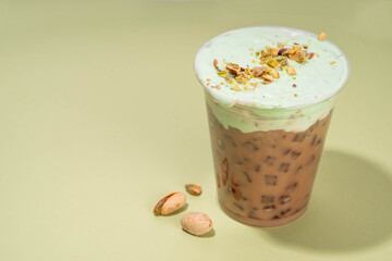 Vegan pistachio milk coffee latte. Iced and hot coffee drinks with plant based whipped pistachio...