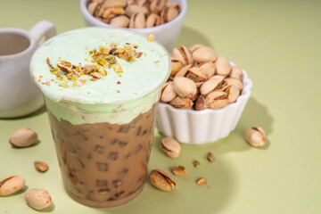 Vegan pistachio milk coffee latte. Iced and hot coffee drinks with plant based whipped pistachio...