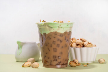 Vegan pistachio milk coffee latte. Iced and hot coffee drinks with plant based whipped pistachio...