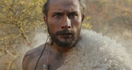 An Intense and Dramatic Portrait of a Prehistoric Hunter Amidst the Wilderness Environment