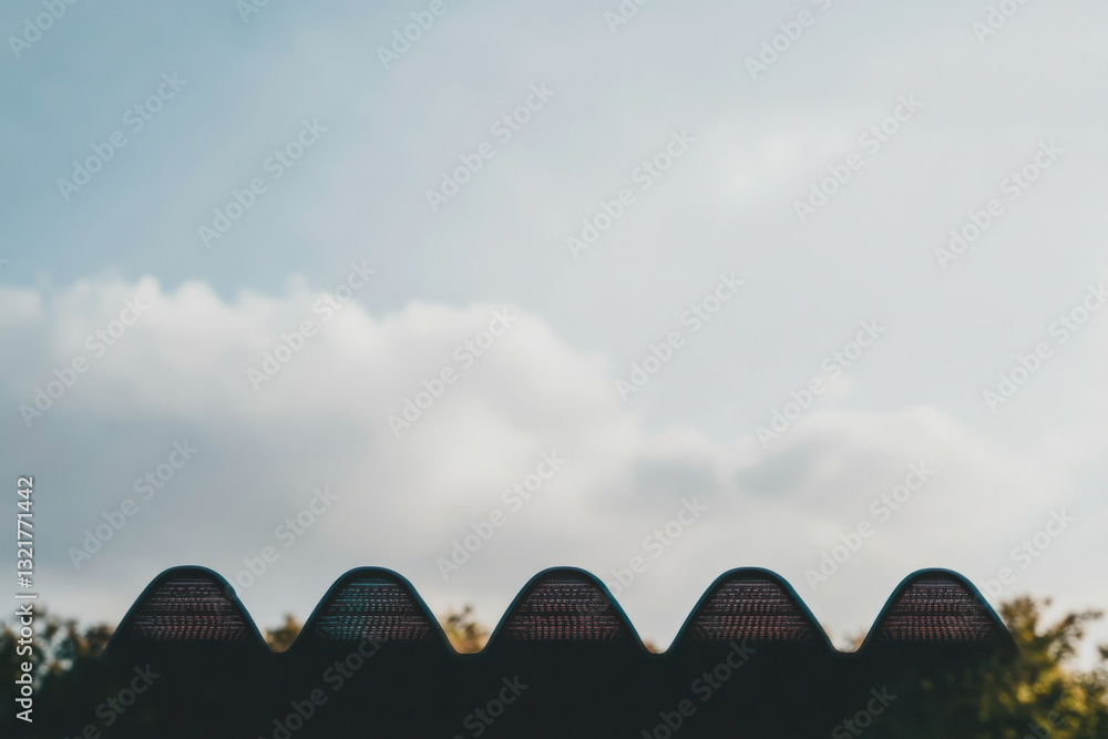 Poster a row of buildings with a cloudy sky in the background