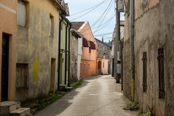 Fototapeta premium Narrow European Street with Colorful Buildings