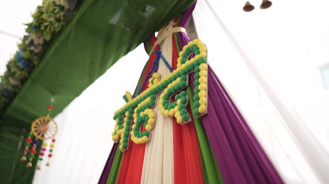 Cinematic Side View of Mehndi Ceremony Decoration, Hindu Wedding Decoration of Mehndi Stage, Indian Wedding Colourful Background