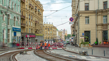 Workers with protective mask welding reinforcement for tram tracks in the city timelapse