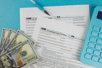 Tax form 1040 on a beautiful blue background, financial document.