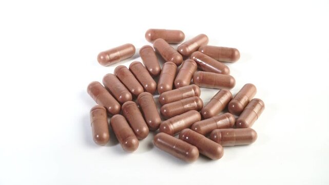 Green Tea Pills on white Background