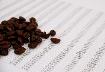 Coffee beans on financial paper close up