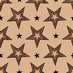 Obraz premium Seamless pattern of leopard print stars on beige background.