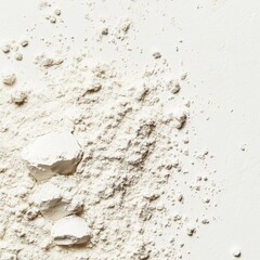 Top view of white powder scattered on a smooth surface, warm background