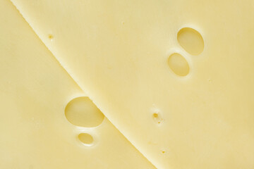 Semi-hard cheese close-up, thin slices, top view