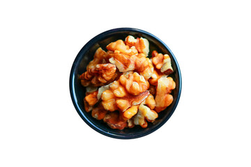 Peeled walnuts in a black bowl transparent on a white background