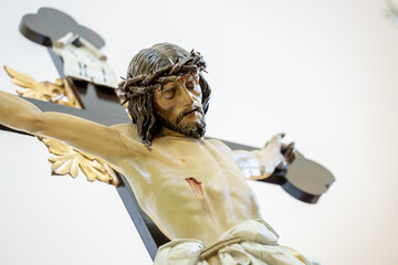 Detailed Close-Up of a Crucifix Statue Depicting Jesus Christ on the Cross
