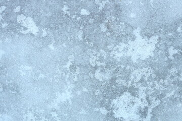Fototapeta premium Close-up shot of snow-covered ground and trees.