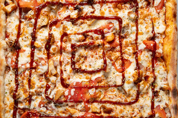Savory pizza with fresh ingredients and a delightful spiral of sauce tempts the taste buds