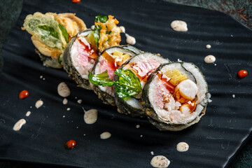 Exquisite sushi rolls filled with fresh seafood, accompanied by artistic sauces and greens