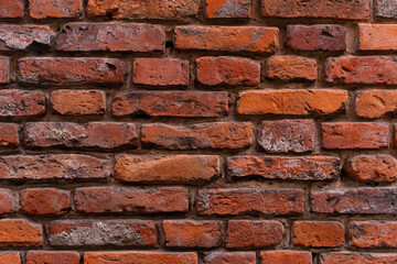 Vintage wall made of red brick.
