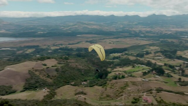 Paragliding hobby flying above the clouds enjoying leisure time couple gift experience extraordinary