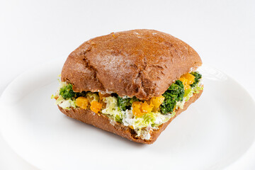 A wholesome sandwich with vibrant broccoli and creamy texture on whole grain bread