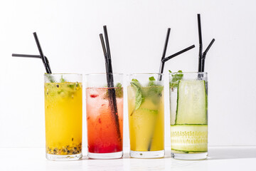 Refreshing beverages with vibrant colors, served in tall glasses, perfect for warm summer days