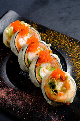 Golden fried sushi rolls display a tempting mix of flavors and textures, perfect for indulgence