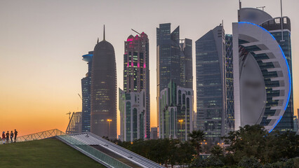 Naklejka premium The high-rise district of Doha day to night timelapse after sunset