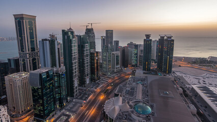 The skyline of the West Bay area from top in Doha night to day timelapse, Qatar.