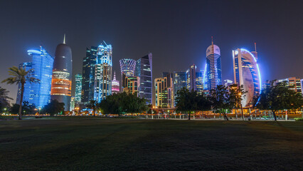 The skyline of Doha by night with starry sky seen from Park timelapse hyperlapse, Qatar