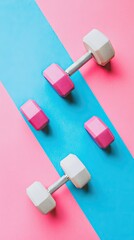 Pink & white dumbbells on blue pink background, fitness concept