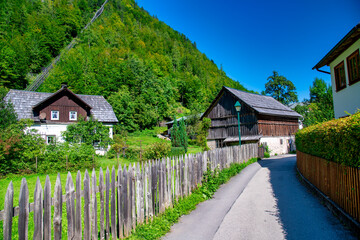 Picturesque view of Hallstatt city and lake, surrounded by stunning alpine mountains and serene waters