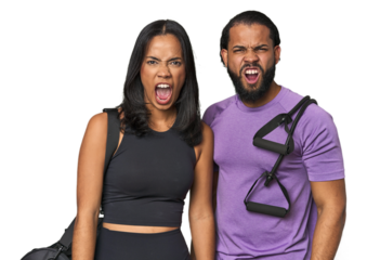 Young Latino couple ready for gym training screaming very angry and aggressive.