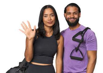 Young Latino couple ready for gym training smiling cheerful showing number five with fingers.