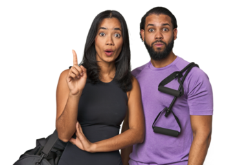 Young Latino couple ready for gym training having some great idea, concept of creativity.