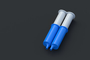 One two-component epoxy resin adhesive in syringe on black background. Glue for metal. Equipment for repair. Copy space. 3d render