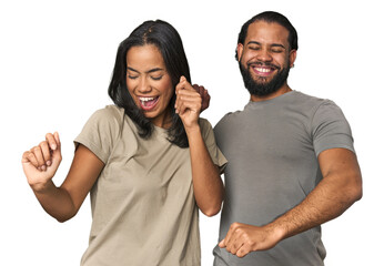 Young Latino couple in studio dancing and having fun.