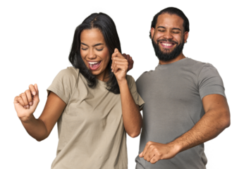 Young Latino couple in studio dancing and having fun.