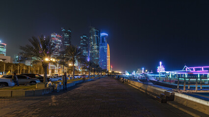 The skyline of Doha by night with starry sky seen from Corniche timelapse hyperlapse, Qatar