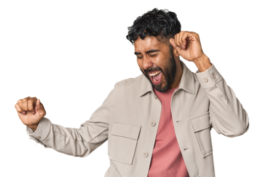 Young Hispanic man isolated dancing and having fun.
