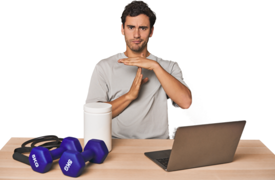 Hispanic trainer planning workout showing a timeout gesture.
