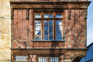ROUEN, NORMANDY, FRANCE - 2025: Rougemare square, Le Vieux Logis, half-timbered and red-brick neo-Gothic house from 19th century, on three floors, famous for its wooden sculptures © Pvince73