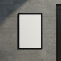 A photograph of a blank poster frame mounted on gray concrete, showcasing a frame mockup.

