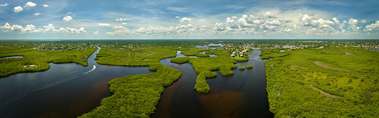 Aerial view of Florida wetlands with green vegetation between ocean water inlets. Natural habitat...