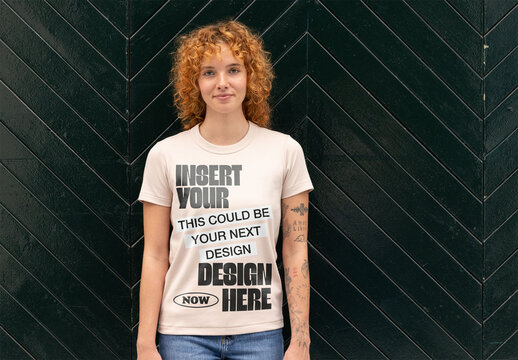 Front View of a Model Showcasing a Plain T-Shirt Against a Dark Background